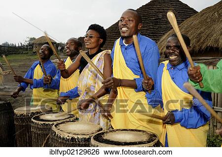 Traditional drummers during a folklore event in a village of former hunters near the village of Kinigi on the edge of the Volcanoes National Park, Parc National des Volcans, Rwanda, Africa View Large Photo Image Stock Photograph - Traditional drummers during a folklore event in a village of former hunters near the village of Kinigi on the edge of the Volcanoes National Park, Parc National des Volcans, Rwanda, Africa. Fotosearch