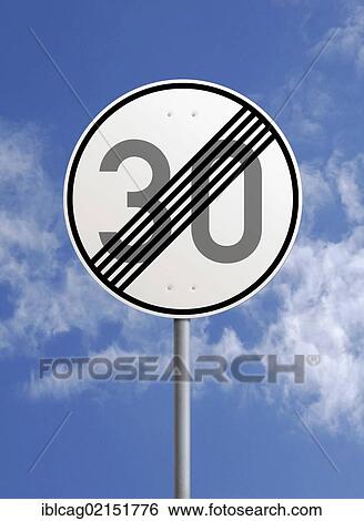 Traffic sign at the end of a 30 km h zone against a blue sky View Large Photo Image Stock Photograph - Traffic sign at the end of a 30 km h zone against a blue sky. Fotosearch