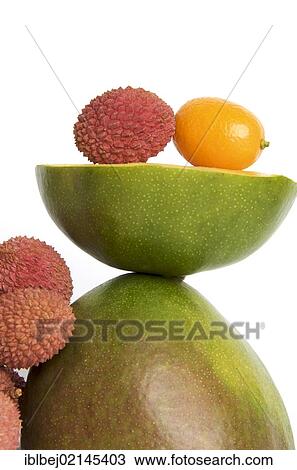 Stock Image - Tropical fruits, Lychees (Litchi chinensis), Kumquat or Cumquat (Citrus japonica), Mango (Mangifera indica). Fotosearch