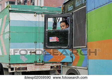 Stock Image - Truck driver, border town Nyalam - Zhangmu on the Friendship Highway Tibet - Nepal, Himalayas, Tibet, China, Asia. Fotosearch