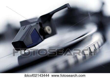 Picture - Turntable playing an LP record. Fotosearch