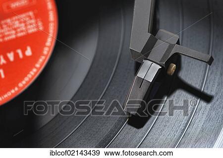 Stock Photo - Turntable playing an LP record. Fotosearch