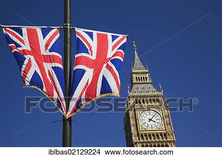 Picture - Union Jack flags fly in front of London's Big Ben, London, England, United Kingdom, Europe. Fotosearch