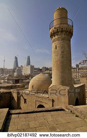 Stock Image - View from the Palace of the Schirwanschahs from the 14th century, with its small mosque, towards the high-rise towers of the three Flame Towers, the new landmark of the city, Baku, Azerbaijan, Caucasus, Middle East, Asia. Fotosearch