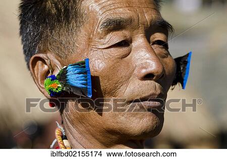 Warrior of the Kachari tribe waiting to perform ritual dances at the Hornbill Festival, Kohima, Nagaland, India, Asia View Large Photo Image Picture - Warrior of the Kachari tribe waiting to perform ritual dances at the Hornbill Festival, Kohima, Nagaland, India, Asia. Fotosearch
