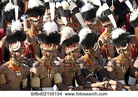 Warriors of the Khiamniungan tribe waiting to perform ritual dances at the Hornbill Festival, Kohima, Nagaland, India, Asia View Large Photo Image Picture - Warriors of the Khiamniungan tribe waiting to perform ritual dances at the Hornbill Festival, Kohima, Nagaland, India, Asia. Fotosearch