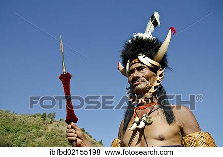 Stock Photo - Warriors of the Konyak tribe waiting to perform ritual dances at the Hornbill Festival, Kohima, Nagaland, India, Asia. Fotosearch