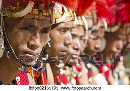 Warriors of the Konyak tribe waiting to perform ritual dances at the Hornbill Festival, Kohima, Nagaland, India, Asia View Large Photo Image Stock Photography - Warriors of the Konyak tribe waiting to perform ritual dances at the Hornbill Festival, Kohima, Nagaland, India, Asia. Fotosearch