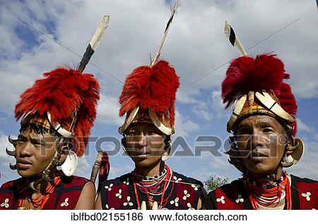 Warriors of the Yimchunger tribe waiting to perform ritual dances at the Hornbill Festival, Kohima, Nagaland, India, Asia View Large Photo Image Stock Photograph - Warriors of the Yimchunger tribe waiting to perform ritual dances at the Hornbill Festival, Kohima, Nagaland, India, Asia. Fotosearch