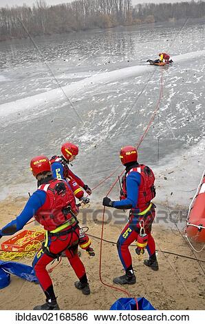 Water rescue team practicing on frozen lake in Meerbusch, Neuss, North Rhine-Westphalia, Germany, Europe View Large Photo Image Stock Photograph - Water rescue team practicing on frozen lake in Meerbusch, Neuss, North Rhine-Westphalia, Germany, Europe. Fotosearch