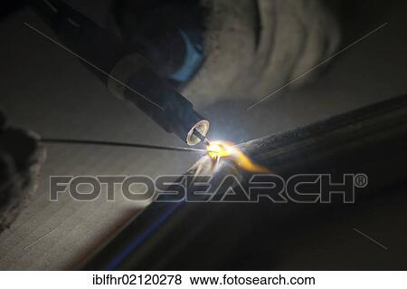 Stock Photo - Welding torch with flame, detail view. Fotosearch