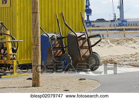 Stock Photo - Wheelbarrows, construction site, HafenCity, Hamburg, Germany, Europe. Fotosearch