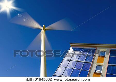Wind turbine and residential building with solar panel View Large Photo Image Stock Image - Wind turbine and residential building with solar panel. Fotosearch