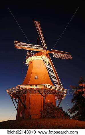 Stock Image - Windmill at night, Dutch gallery type, one of the twin mills of Greetsiel, East Frisia, Lower Saxony, Germany, Europe. Fotosearch