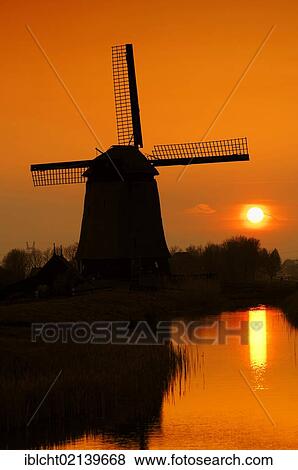 Stock Photo - Windmill at sunset, Schermerhorn, Schermer, North Holland, Holland, Netherlands, Europe. Fotosearch