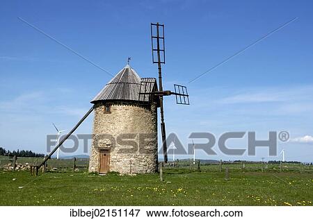 Windmill on the Plateau d'Ally-Mercoeur, wind turbines at back, Haute Loire, Auvergne, France, Europe View Large Photo Image Stock Photo - Windmill on the Plateau d'Ally-Mercoeur, wind turbines at back, Haute Loire, Auvergne, France, Europe. Fotosearch