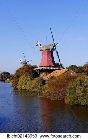 Windmills, Dutch gallery type, twin mills, Greetsiel, East Frisia, Lower Saxony, Germany, Europe View Large Photo Image Stock Photo - Windmills, Dutch gallery type, twin mills, Greetsiel, East Frisia, Lower Saxony, Germany, Europe. Fotosearch