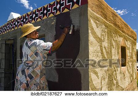 Woman painting the facade of a house, Basotho Cultural Village, Golden Gate National Park, Free State, South Africa, Africa View Large Photo Image Stock Photo - Woman painting the facade of a house, Basotho Cultural Village, Golden Gate National Park, Free State, South Africa, Africa. Fotosearch