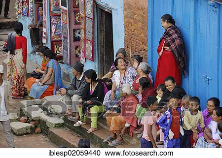 Stock Image - Women and children, Taumadhi square, Bhaktapur, Kathmandu Valley, Nepal, Asia. Fotosearch