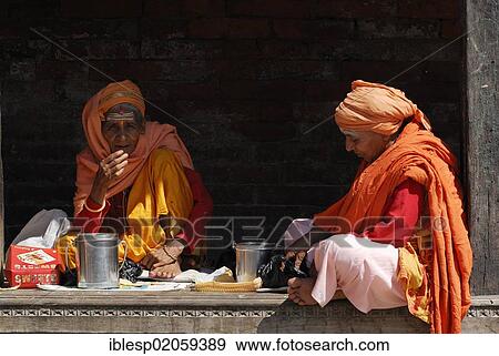 Stock Photo - Women sitting on a step, Pashupatinath, Kathmandu, Nepal, Asia. Fotosearch