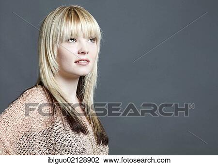 Young blond woman, portrait View Large Photo Image Stock Image - Young blond woman, portrait. Fotosearch