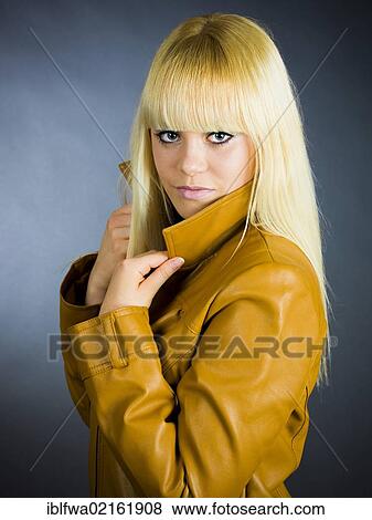 Young blond woman wearing a leather jacket View Large Photo Image Stock Photo - Young blond woman wearing a leather jacket. Fotosearch