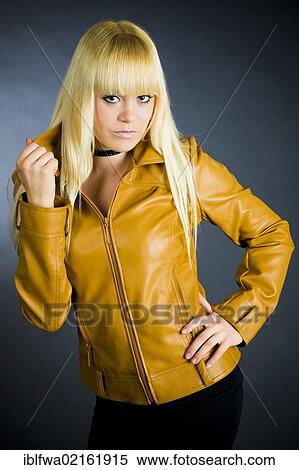 Young blond woman wearing a leather jacket View Large Photo Image Stock Photography - Young blond woman wearing a leather jacket. Fotosearch