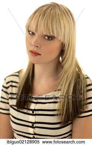 Stock Photography - Young blond woman wearing a striped top, portrait. Fotosearch