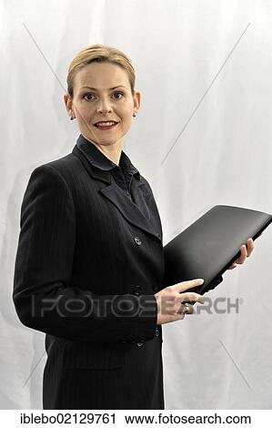 Young businesswoman, manager, before going into a meeting View Large Photo Image Stock Image - Young businesswoman, manager, before going into a meeting. Fotosearch