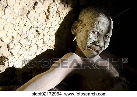 Picture - Young person, painted face, traditional circumcision ceremony, Transkei, Eastern Cape, South Africa, Africa. Fotosearch