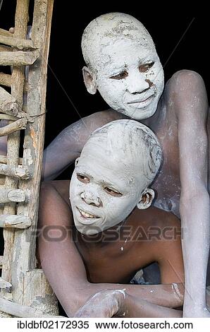 Stock Photography - Young persons with painted faces, traditional circumcision ceremony, Transkei, Eastern Cape, South Africa, Africa. Fotosearch