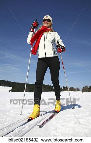 Young woman, about 25 years, against a blue sky, cross-country skiing, near Masserberg, Thuringian Forest mountains, Thuringia, Germany, Europe View Large Photo Image Stock Image - Young woman, about 25 years, against a blue sky, cross-country skiing, near Masserberg, Thuringian Forest mountains, Thuringia, Germany, Europe. Fotosearch