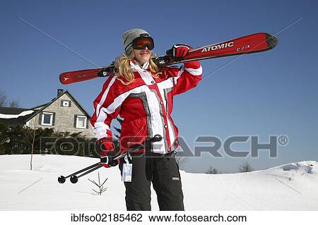 Young woman, about 25 years, carrying skis on her shoulder, near Masserberg, Thuringian Forest mountains, Thuringia, Germany, Europe View Large Photo Image Stock Image - Young woman, about 25 years, carrying skis on her shoulder, near Masserberg, Thuringian Forest mountains, Thuringia, Germany, Europe. Fotosearch
