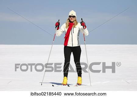 Stock Image - Young woman, about 25 years, cross-country skiing, near Masserberg, Thuringian Forest mountains, Thuringia, Germany, Europe. Fotosearch