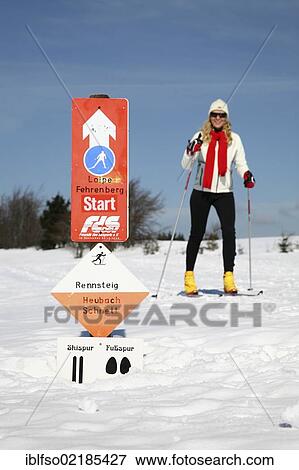 Stock Photo - Young woman, about 25 years, cross-country skiing, near Masserberg, Thuringian Forest mountains, Thuringia, Germany, Europe. Fotosearch