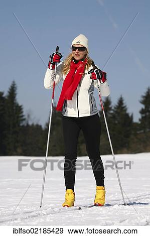 Stock Photo - Young woman, about 25 years, cross-country skiing, near Masserberg, Thuringian Forest mountains, Thuringia, Germany, Europe. Fotosearch
