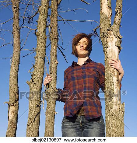 Young woman in communion with nature View Large Photo Image Stock Photo - Young woman in communion with nature. Fotosearch