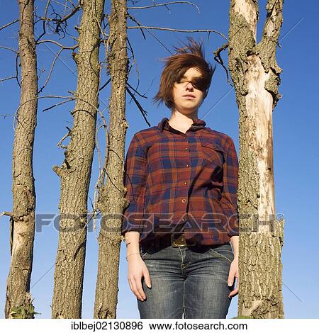 Young woman in communion with nature View Large Photo Image Stock Photograph - Young woman in communion with nature. Fotosearch