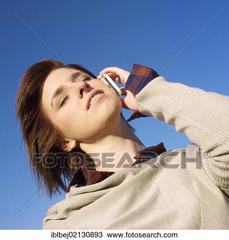 Young woman on the mobile phone View Large Photo Image Stock Image - Young woman on the mobile phone. Fotosearch