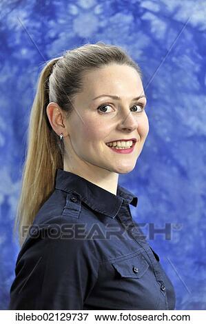 Stock Photo - Young woman smiling, looking happy and content. Fotosearch