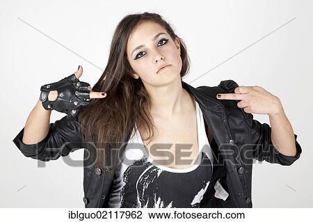 Young woman wearing a leather jacket with a cool pose View Large Photo Image Stock Image - Young woman wearing a leather jacket with a cool pose. Fotosearch