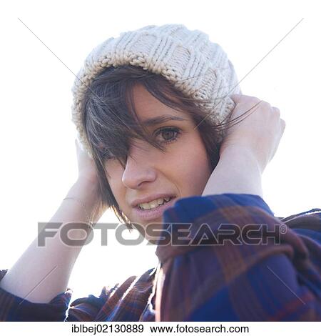 Young woman with a cap View Large Photo Image Stock Photo - Young woman with a cap. Fotosearch