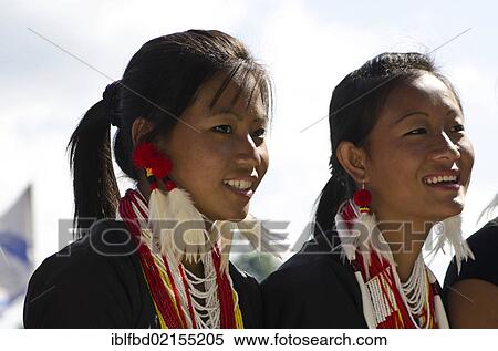 Young women of the Konyak tribe waiting to perform ritual dances at the Hornbill Festival, Kohima, Nagaland, India, Asia View Large Photo Image Stock Photography - Young women of the Konyak tribe waiting to perform ritual dances at the Hornbill Festival, Kohima, Nagaland, India, Asia. Fotosearch