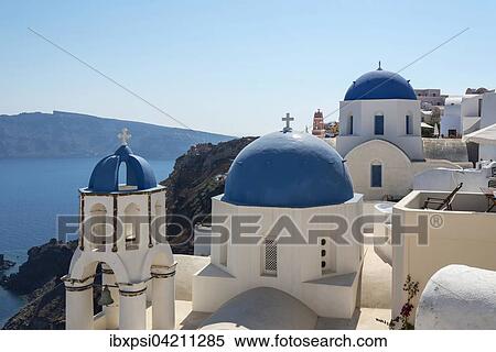 Blue-domed church of Agios Spiridonas and the church of Anastasis, Oia, Santorini, Greece, Europe View Large Photo Image Stock Photography - Blue-domed church of Agios Spiridonas and the church of Anastasis, Oia, Santorini, Greece, Europe. Fotosearch