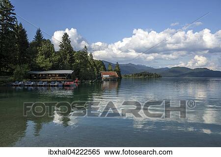 Boathouse on Walchensee lake, reflections in the water, clouds, at Einsiedl, Upper Bavaria, Bavaria, Germany, Europe View Large Photo Image Stock Photography - Boathouse on Walchensee lake, reflections in the water, clouds, at Einsiedl, Upper Bavaria, Bavaria, Germany, Europe. Fotosearch