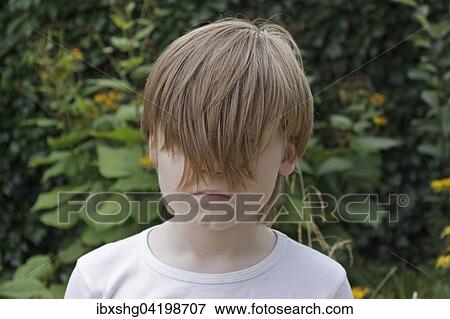 Stock Photo - Boy with long hair, Germany, Europe. Fotosearch