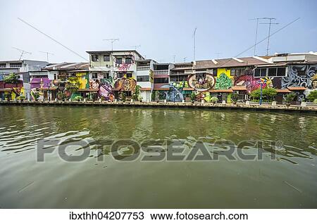 Stock Image - Brightly painted house fronts along the Malacca River, district of Kampung Bakar Batu, Malacca or Melaka, Malaysia, Asia. Fotosearch