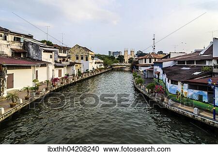 Stock Image - Brightly painted houses along the Malacca River, district of Kampung Bakar Batu, Malacca or Melaka, Malaysia, Asia. Fotosearch