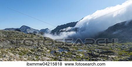 Clouds passing over Bergkam with small mountain lakes, Klafferkessel, Upper Klaffersee, Greifenberg 2618 m, Untertal, Schladming Tauern, Alps, Styria, Austria, Europe View Large Photo Image Stock Photo - Clouds passing over Bergkam with small mountain lakes, Klafferkessel, Upper Klaffersee, Greifenberg 2618 m, Untertal, Schladming Tauern, Alps, Styria, Austria, Europe. Fotosearch