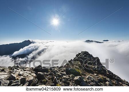 Clouds passing over the mountain ridge, view from Greifenberg at 2618m, Rohrmoss-Untertal, Schladming Tauern, Alps, Styria, Austria, Europe View Large Photo Image Stock Photo - Clouds passing over the mountain ridge, view from Greifenberg at 2618m, Rohrmoss-Untertal, Schladming Tauern, Alps, Styria, Austria, Europe. Fotosearch